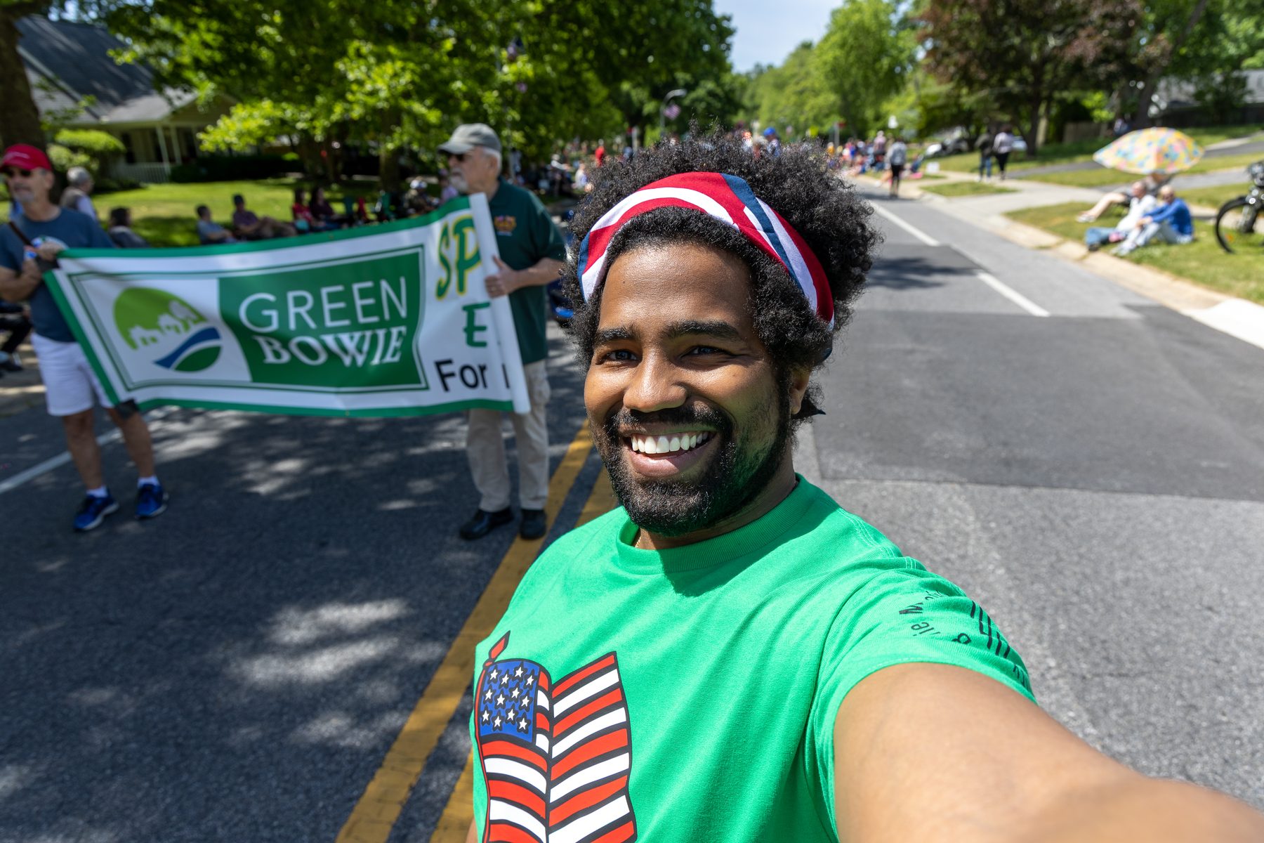 Preston Thomas smiling at a Green Bowie parade event